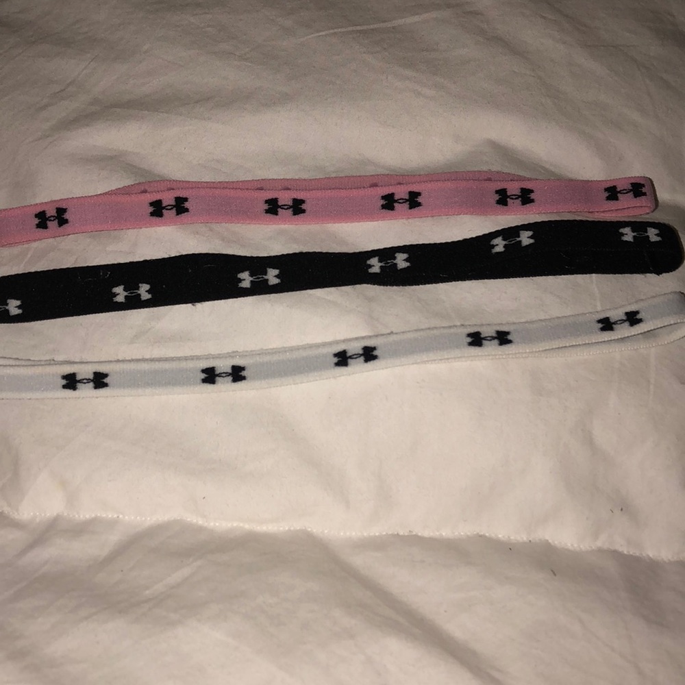 Three Under Armour headbands